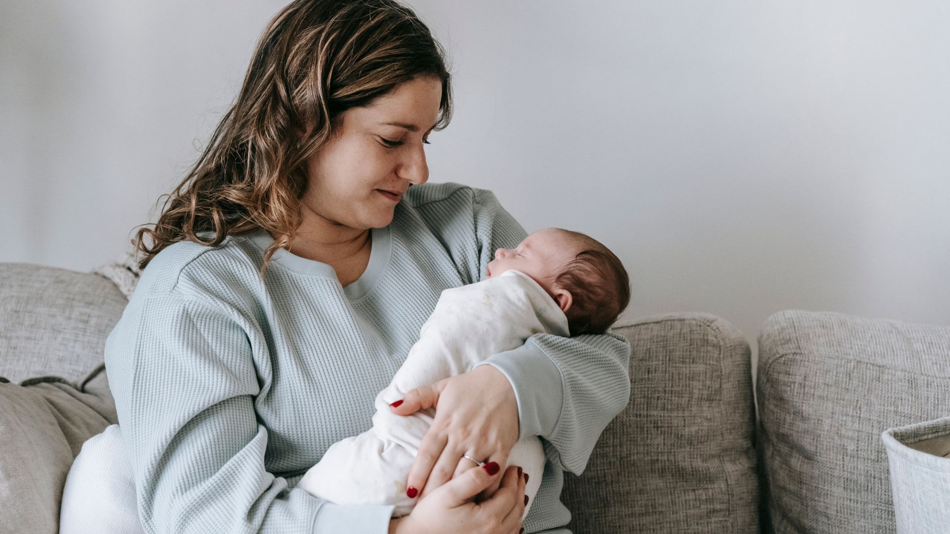 A woman holding a baby in her arms